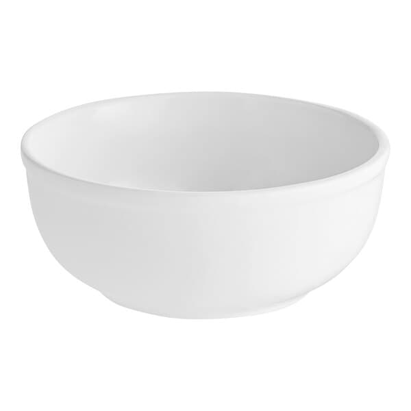 An Acopa bright white stoneware nappie bowl with a rolled edge on a white background.