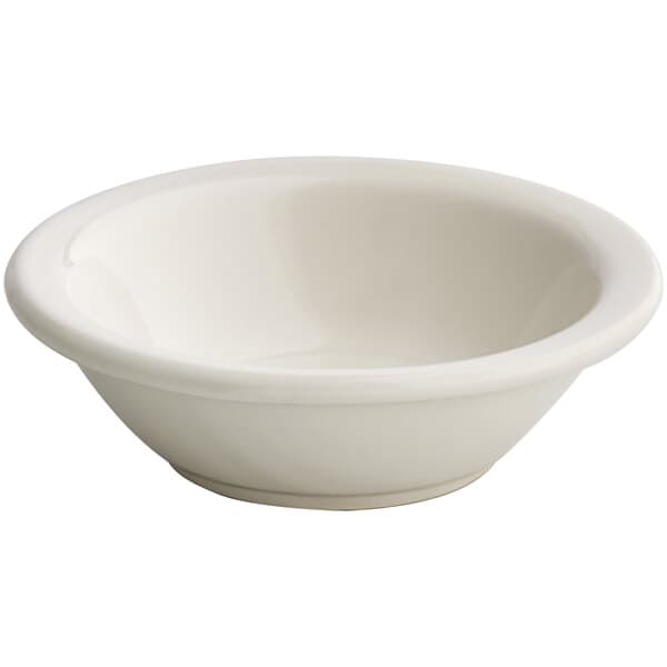 a white bowl with a spoon