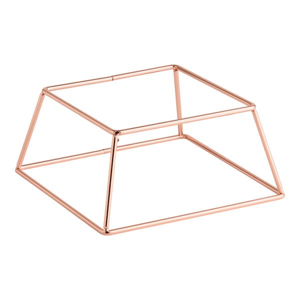 A square rose gold metal display stand with an open geometric frame design.