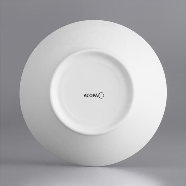 A close-up of a white Acopa Liana porcelain bowl with embossed lines.