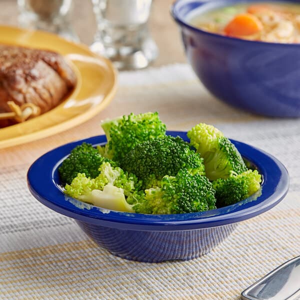 An Acopa Foundations blue melamine bowl filled with broccoli.