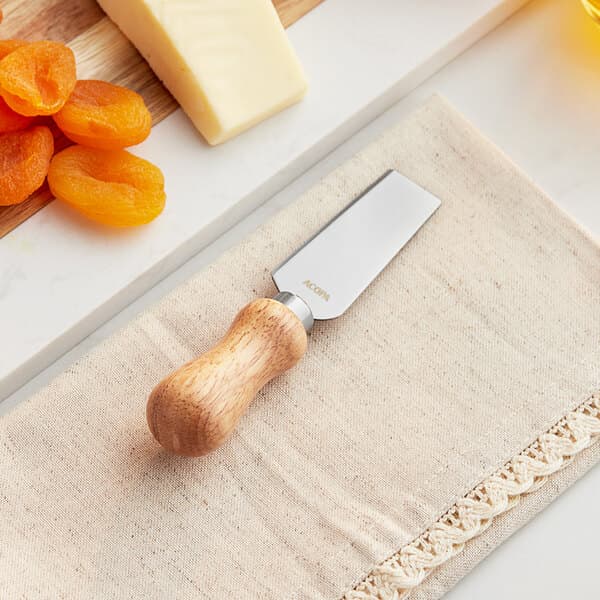 An Acopa stainless steel cheese knife with a wood handle.