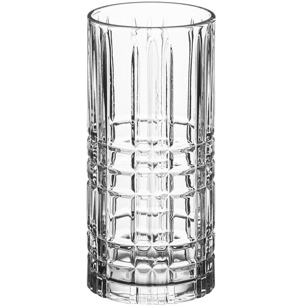 A close-up of an Acopa clear glass with a checkered pattern.