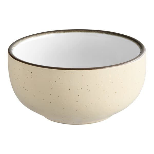 A white stoneware bowl with a black rim.