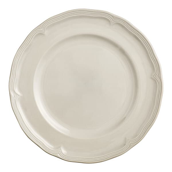 A white Acopa Condesa porcelain plate with a scalloped white rim.