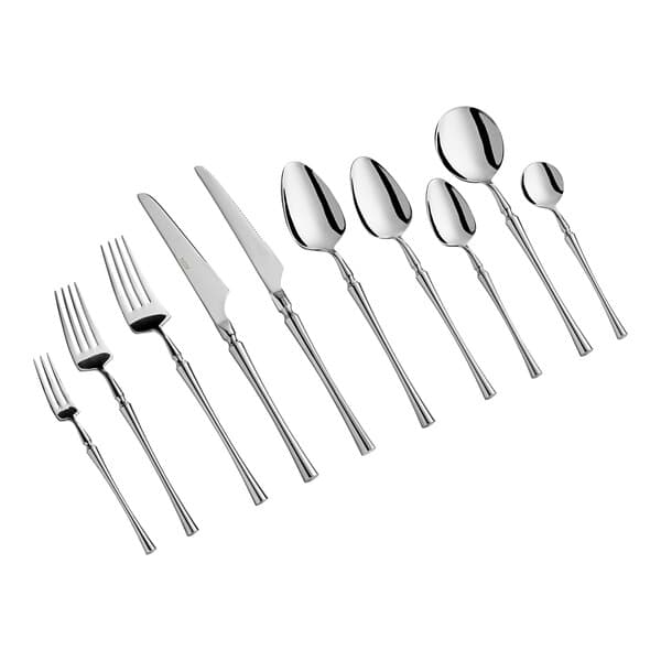 A close-up of a set of Acopa stainless steel salad/dessert forks.