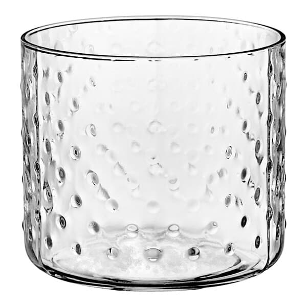 A clear Acopa cylindrical glass votive candle holder with a hobnail design.