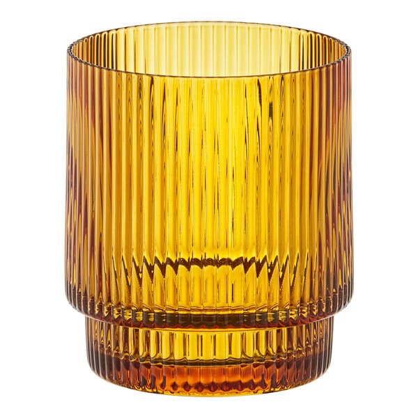 An Acopa Lore amber glass tealight holder with a ribbed striped pattern.