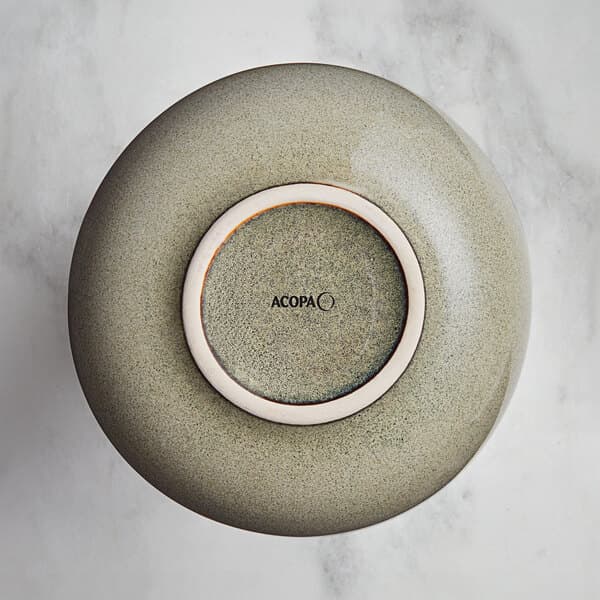 A Heather Gray ceramic sauce cup with a white rim.